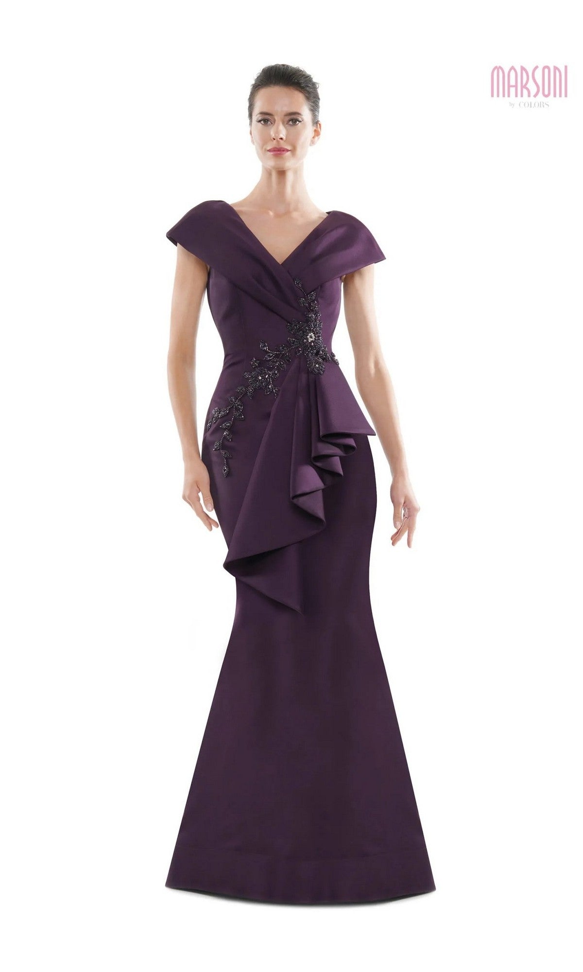 A woman wearing the Marsoni MV1086 long formal dress in eggplant, featuring beaded embellishments.